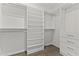 Spacious walk-in closet with built-in shelving, drawers, and ample storage space at 7180 E Kierland Blvd # 1218, Scottsdale, AZ 85254