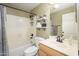 Bright bathroom featuring a shower-tub combo, white shelving and sleek fixtures at 8331 E Plata Ave, Mesa, AZ 85212