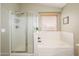 Bathroom featuring a shower, a tub, and tile flooring at 8331 E Plata Ave, Mesa, AZ 85212