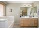 Bathroom with double sinks and a soaking tub at 8331 E Plata Ave, Mesa, AZ 85212