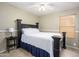 Bedroom with tile floors featuring a ceiling fan, a dark bed frame and a window with blinds at 8331 E Plata Ave, Mesa, AZ 85212