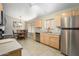 Bright kitchen featuring stainless steel appliances and eat-in dining area, creating a convenient and inviting space at 8331 E Plata Ave, Mesa, AZ 85212