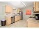 Functional kitchen features stainless steel appliances, light wood cabinets and tile flooring at 8331 E Plata Ave, Mesa, AZ 85212