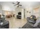 Open-concept living room seamlessly connects to the dining area and kitchen, creating a perfect space for Gathering gatherings at 8331 E Plata Ave, Mesa, AZ 85212