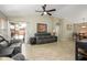 Spacious living room with access to patio and dining area, offering seamless indoor-outdoor living and entertaining at 8331 E Plata Ave, Mesa, AZ 85212