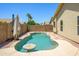 Backyard pool featuring a sitting area and bordered by landscaping at 8331 E Plata Ave, Mesa, AZ 85212