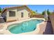 Backyard pool surrounded by stone and artificial turf at 8331 E Plata Ave, Mesa, AZ 85212