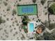 Overhead view of community pool, tennis courts, and surrounding desert landscape at 856 E Village Cir S Dr, Phoenix, AZ 85022