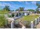 Expansive backyard view features lush green grass, patio, and stylish landscaping and fountain at 856 E Village Cir S Dr, Phoenix, AZ 85022