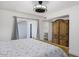 Bright bedroom featuring a wooden wardrobe and direct access to the outdoor with sliding glass doors at 856 E Village Cir S Dr, Phoenix, AZ 85022