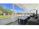 Relaxing covered patio with comfortable seating, charming string lights, and a view of the backyard at 856 E Village Cir S Dr, Phoenix, AZ 85022