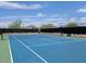Community tennis court surrounded by desert scenery and mountain views at 856 E Village Cir S Dr, Phoenix, AZ 85022