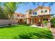 Spacious backyard featuring a barrel sauna, covered patio, and lush green lawn at 8845 E Larkspur Dr, Scottsdale, AZ 85260