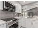 Modern kitchen featuring white cabinets and stainless steel appliances at 8845 E Larkspur Dr, Scottsdale, AZ 85260