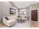 Bright living room featuring vaulted ceilings, modern décor, and hardwood floors at 8845 E Larkspur Dr, Scottsdale, AZ 85260