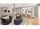 Comfortable living room featuring modern decor, hard wood floors, and view of the kitchen at 8845 E Larkspur Dr, Scottsdale, AZ 85260