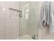 Shower with clear glass door and white tiled walls, including a built-in niche at 8845 E Larkspur Dr, Scottsdale, AZ 85260