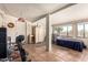Basement area converted to bedroom/exercise area with tile floors, closet, and abundant light at 962 S Main Dr, Apache Junction, AZ 85120