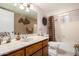 Bathroom with a large mirror, marbled countertop, framed mirror, shower and bathtub at 962 S Main Dr, Apache Junction, AZ 85120