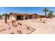 View of a single story home with brick and vinyl siding, xeriscaping and an attached garage at 962 S Main Dr, Apache Junction, AZ 85120