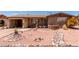 Charming single-story brick home with desert landscaping, rock accents, and a welcoming walkway at 962 S Main Dr, Apache Junction, AZ 85120