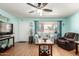 Bright and airy living room with hardwood floors, soft blue walls and comfortable seating at 962 S Main Dr, Apache Junction, AZ 85120
