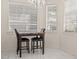 Bright breakfast nook with table and chairs, featuring large windows at 11983 W Fillmore St, Avondale, AZ 85323