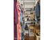Organized walk-in closet with built-in shelving for shoes and clothing storage at 11983 W Fillmore St, Avondale, AZ 85323
