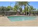 Inviting community pool surrounded by lush landscaping and seating areas at 11983 W Fillmore St, Avondale, AZ 85323