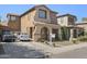 Lovely two-story home boasts a stucco exterior, a tiled roof, and a manicured front lawn at 11983 W Fillmore St, Avondale, AZ 85323