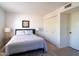 Cozy bedroom features a comfortable bed, soft lighting, and ample closet space at 1302 E Nicolet Ave, Phoenix, AZ 85020