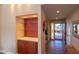 Inviting foyer with stylish built-in shelving and views to the front entrance and landscaped exterior at 1302 E Nicolet Ave, Phoenix, AZ 85020