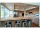 Open kitchen with countertop seating, stainless steel appliances, and ample natural light at 1302 E Nicolet Ave, Phoenix, AZ 85020