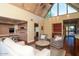 Open living room with tiled floors, clerestory windows, and a view of the kitchen and dining area at 1302 E Nicolet Ave, Phoenix, AZ 85020