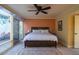 Inviting main bedroom with private patio, neutral color palette, decorative ceiling fan, and elegant decorative rug at 1302 E Nicolet Ave, Phoenix, AZ 85020