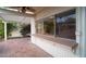 Outdoor patio with a pass-through window connecting to the indoor kitchen, perfect for entertaining at 1302 E Nicolet Ave, Phoenix, AZ 85020