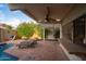 Inviting outdoor patio featuring lounge chairs, a built-in bar, pool access and lush landscaping at 1302 E Nicolet Ave, Phoenix, AZ 85020