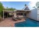 Backyard with a private pool, patio, pergola, sun loungers, and outdoor seating for relaxing and entertaining at 1302 E Nicolet Ave, Phoenix, AZ 85020
