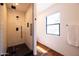 Bathroom features a glass enclosed shower with modern fixtures and a small window at 1546 W Culver St, Phoenix, AZ 85007