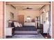 Beautiful bedroom features stylish furnishings, a ceiling fan, and a sink with vanity inside a garage conversion at 1546 W Culver St, Phoenix, AZ 85007