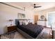Charming bedroom with comfortable bed, ceiling fan, and convenient sink and vanity, offering a cozy, functional space at 1546 W Culver St, Phoenix, AZ 85007