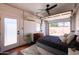 Stylish garage conversion bedroom with modern decor, sleek ceiling fan, and bright natural light at 1546 W Culver St, Phoenix, AZ 85007