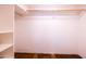 Walk-in closet with wooden clothing rod and shelving on the left at 1546 W Culver St, Phoenix, AZ 85007