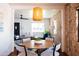 Open-concept dining area showcases exposed brick wall, round table, and a bright interior at 1546 W Culver St, Phoenix, AZ 85007
