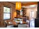 Modern dining area boasts exposed brick, a stylish pendant light, and open-concept kitchen at 1546 W Culver St, Phoenix, AZ 85007