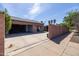 Exterior view of a property with a large driveway and a multi-car garage at 1546 W Culver St, Phoenix, AZ 85007