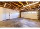 Spacious garage with exposed beams and ample room for parking and storage at 1546 W Culver St, Phoenix, AZ 85007