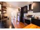 Bright kitchen with stainless steel appliances and dark cabinets at 1546 W Culver St, Phoenix, AZ 85007