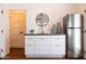 Modern kitchenette features white cabinetry, stainless steel refrigerator, and stylish decor at 1546 W Culver St, Phoenix, AZ 85007