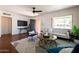 Cozy living room featuring modern decor, a large window, and comfortable seating at 1546 W Culver St, Phoenix, AZ 85007